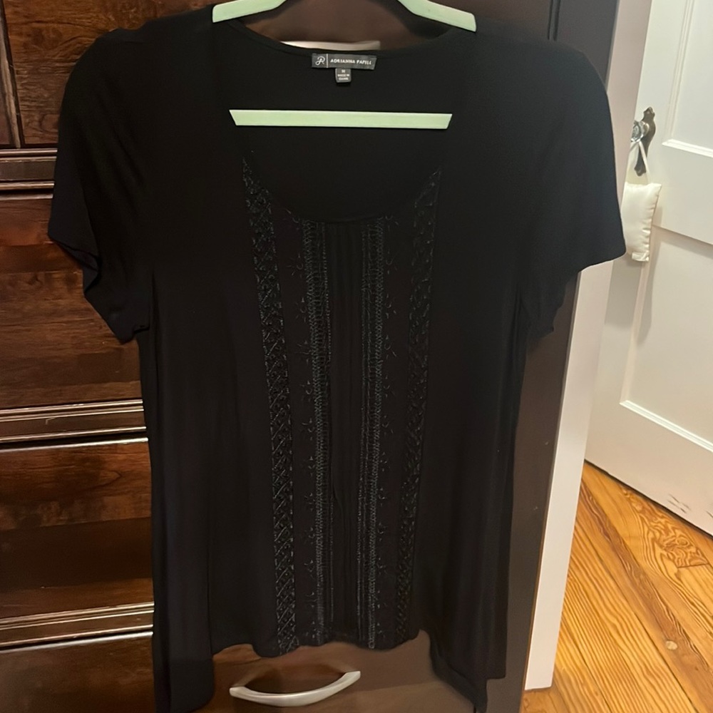 Black shark bite hem top. Knit. Pretty detail on front. Flattering style. Size M